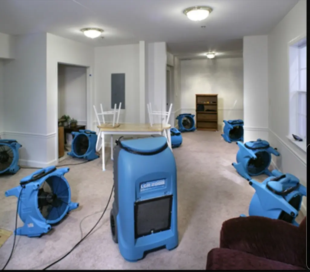 Air movers and dehumidifier setup for Water Damage Restoration in Hyde Park